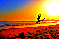 Ballerina Flying Threw the Air on Beach Sunset